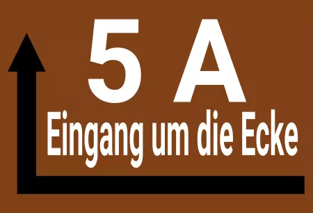 Wegweiser Eingang um die Ecke Bild