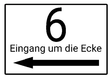 Wegweiser Eingang um die Ecke Bild