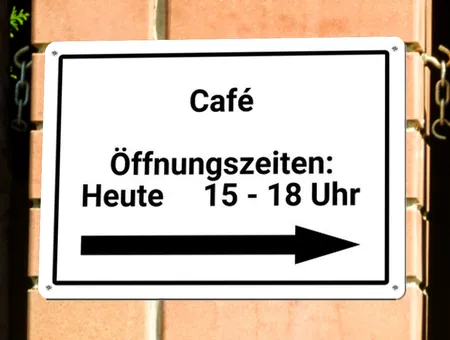 Wegweiser Öffnungszeiten Cafe Bild